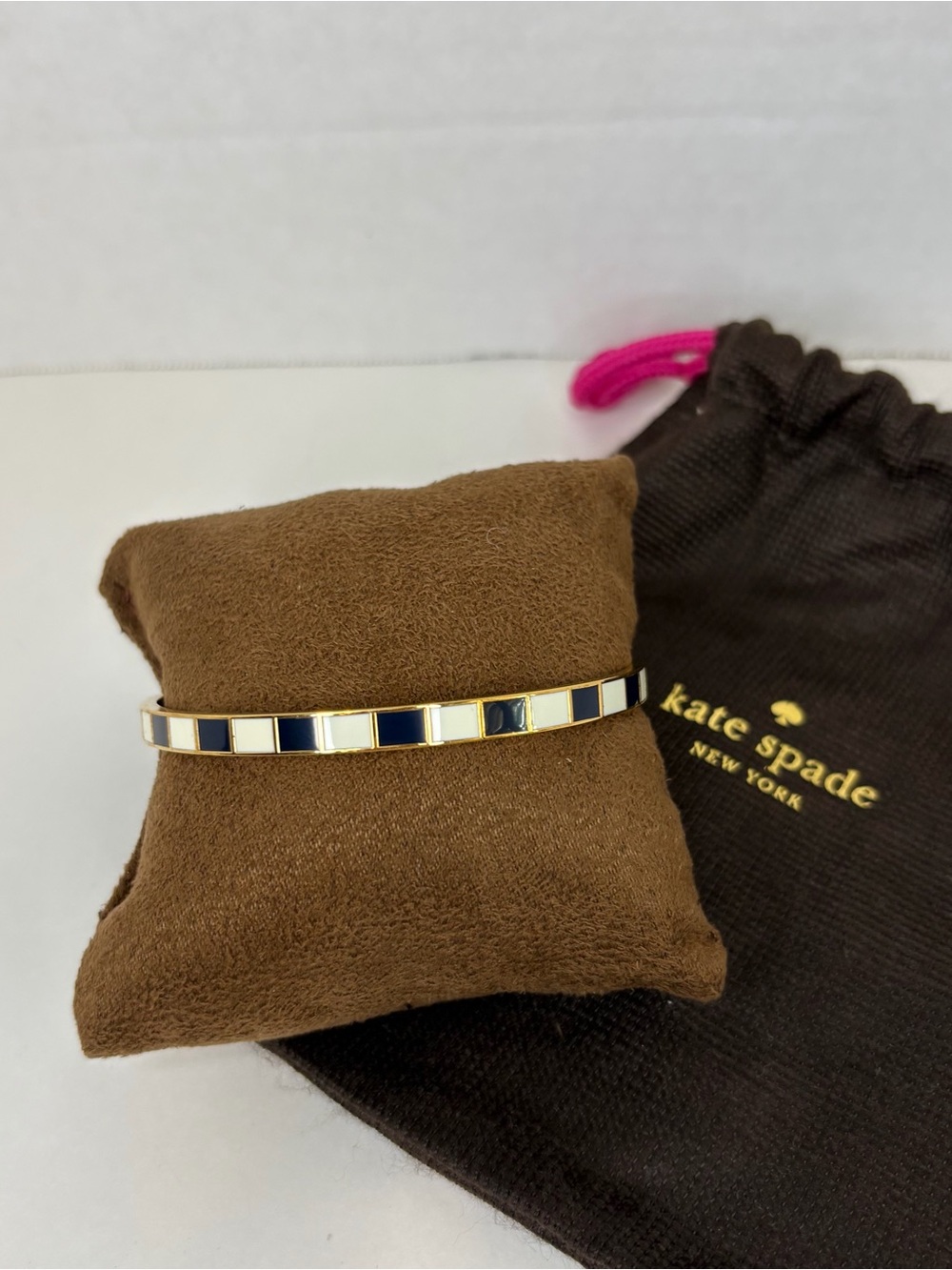 Kate-Spade gold-tone black and white enamel bracelet